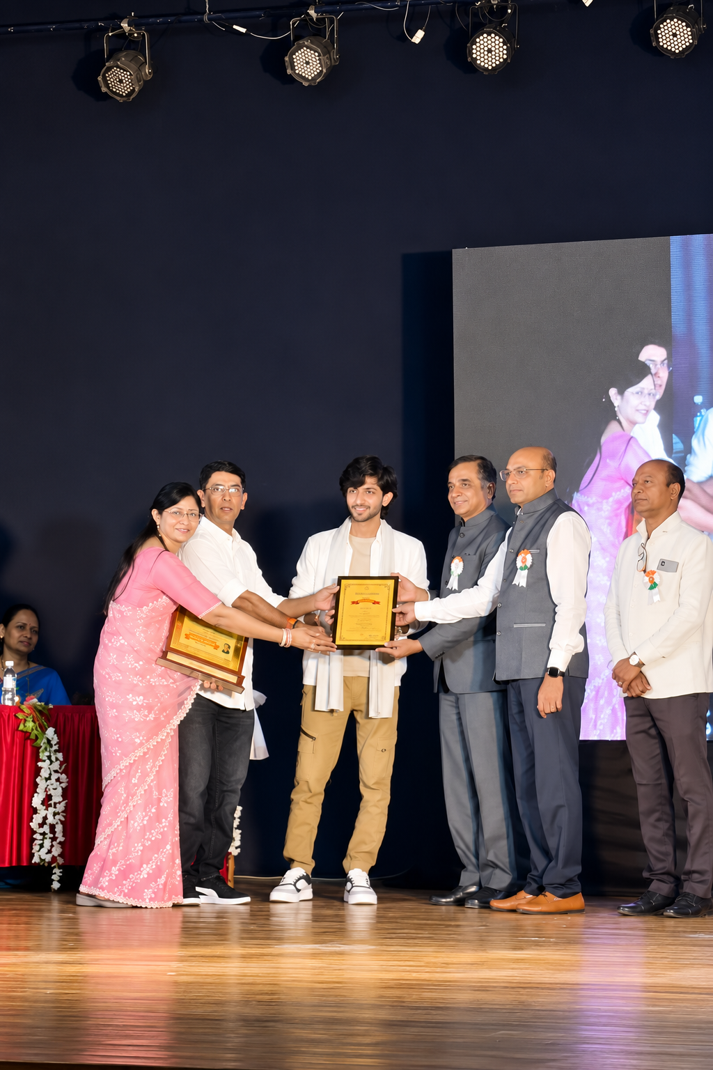 Harsh Patil sir receiving an award on stage for his indoor saffron farming work